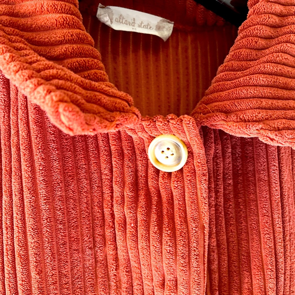 Alter’d State Corduroy Jacket in burnt orange with front pockets and long sleeve